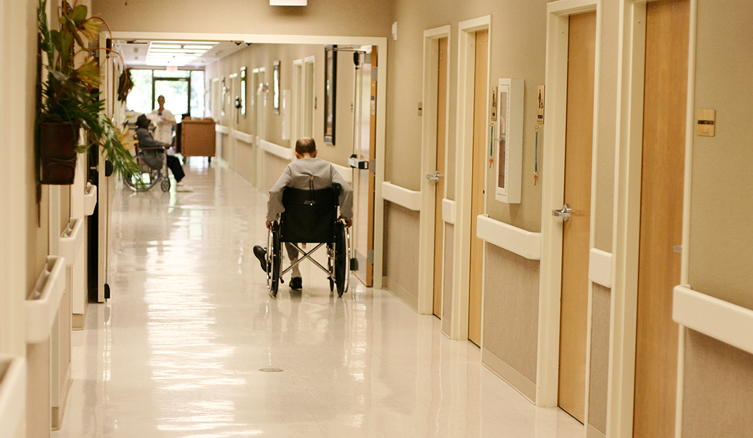Man in wheelchair in hallway