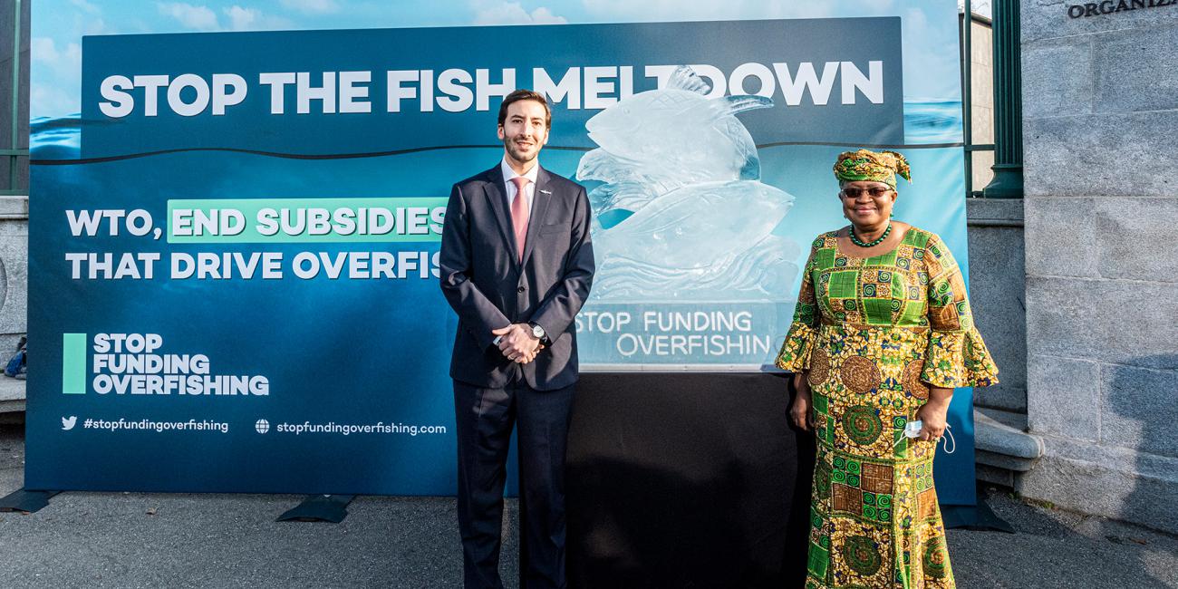WTO Director-General Ngozi Okonjo-Iweala and Colombian Ambassador to the WTO Santiago Wills at the Stop Funding Overfishing display outside the World Trade Organization headquarters in 2021.