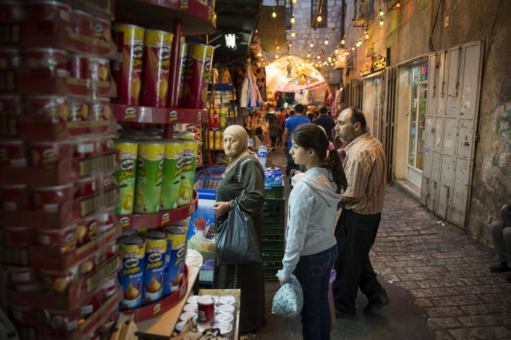 People buying food at a Jerusalem store